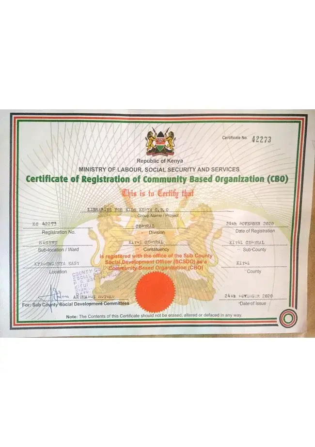 A Kenyan government certificate of registration for a community based organization, with a red seal